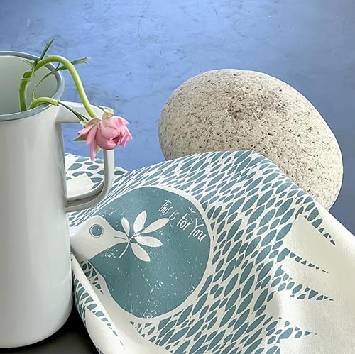 Dove tea towel 100% cotton. Printed in sky blue with the words "This is for you." Original artwork by Susy Pilgrim Waters