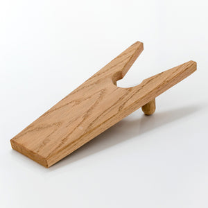 Oak wood boot jack on a white background. Handmade in Gloucester, MA, USA by PilgrimWaters.