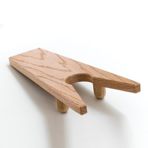 Oak wood boot jack on a white background. Handmade in Gloucester, MA USA.