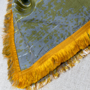 Cotton Silk Mini square neckerchief close up of the Cups Mustard print design by PilgrimWaters with detail of the eyelash four edge fringe.