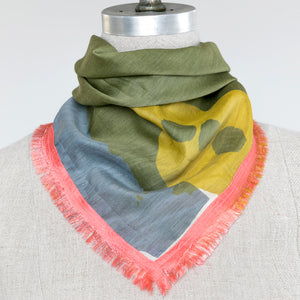 Cotton Silk Mini square scarf printed with a design by PilgrimWaters and edged with Ember Glow eyelash edges tied on a mannequin.