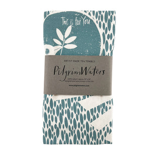 Dove tea towel folded and packaged with PilgrimWaters kraft band — artist-designed, handprinted in the USA, 100% cotton flour sack.