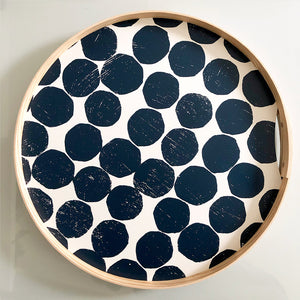 A round Blueberry printed dot tray. Hand-printed design featuring Blueberry PilgrimWaters dots on a cotton white background, banded with a natural ash wood edge. The tray is displayed head-on.