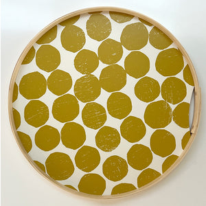 A round orche printed dot tray. Hand-printed design featuring PilgrimWaters dots on a cotton white background, with a natural ash wood edge. The tray is displayed head-on.