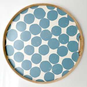 A round Sky dot tray. Hand-printed design featuring PilgrimWaters Sky dots on a cotton white background, bound with a natural ash wood edge. The tray is displayed head-on.