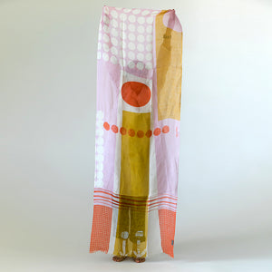 Banjo Coral Cotton Linen scarf held vertically to display the handprinted design.