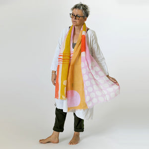 Banjo Coral large cotton linen scarf being styled, showing the large abstract design.