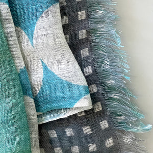 Banjo Sea Cotton Linen scarf close-up, showing the delicate fringe and design pattern.