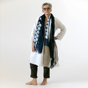 Banjo Harbor large cotton linen scarf being styled, showing the large abstract design.