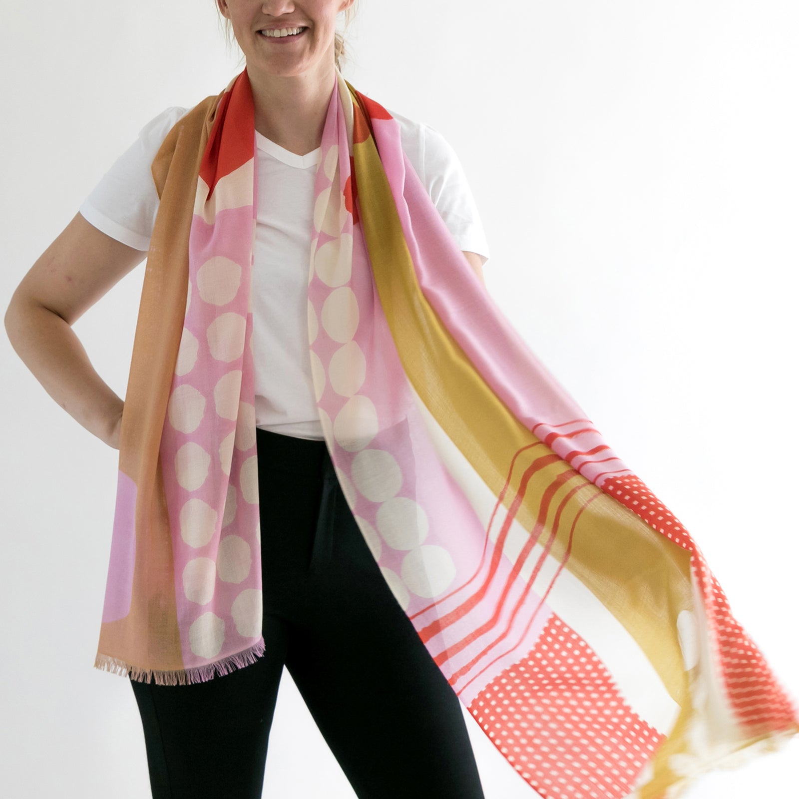 Banjo Quinn merino wool scarf draped on Susy. Large oversized scarf ideal for summer and winter. An abstract print designed by Susy Pilgrim Waters and handprinted in Nepal.