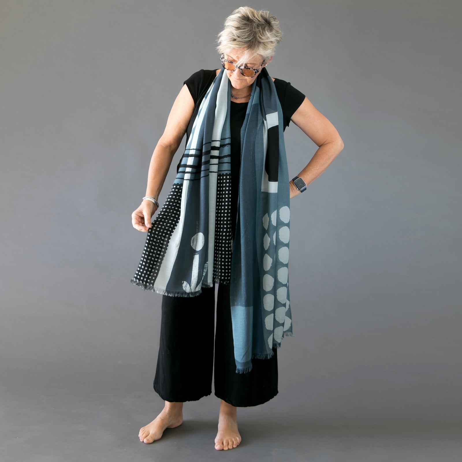 Banjo Quinn merino wool scarf draped on Susy. Large oversized scarf ideal for summer and winter. An abstract print designed by Susy Pilgrim Waters and handprinted in Nepal.