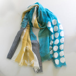 Banjo Sea Cotton Linen scarf tied in a knot, displaying the abstract handprinted design.