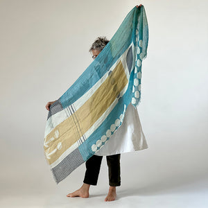 Banjo Sea large cotton/linen scarf, held to show the large abstract design.