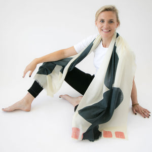 Boulder Cloud Merino Wool scarf draped on a model sitting on the floor.