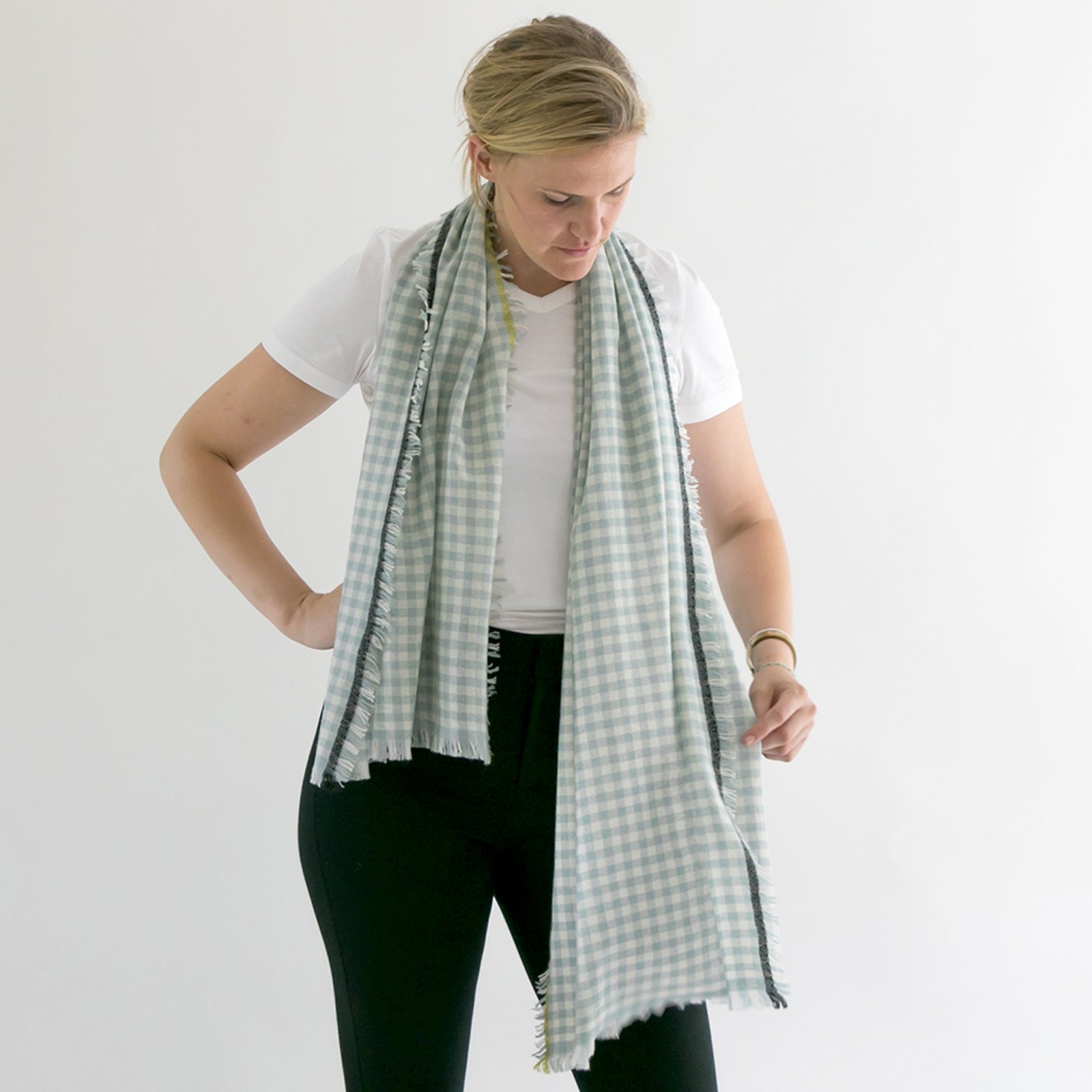 Horizon Cashmere scarf, gingham draped on the model.