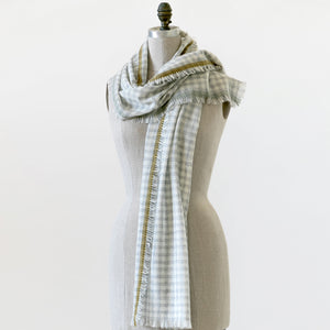 100% cashmere Moxie scarf draped on a mannaquin.