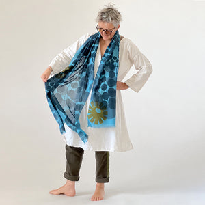 Echo Escape merino wool scarf styled by Susy Pilgrim Waters — abstract botanical print, handmade in Nepal