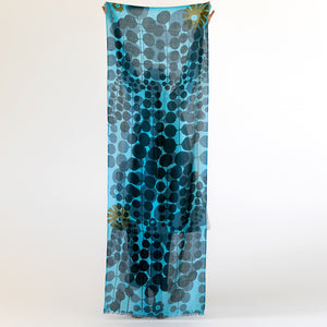 Echo Escape merino wool scarf held full length by Susy Pilgrim Waters — oversized abstract botanical print, handmade and hand printed in Nepal