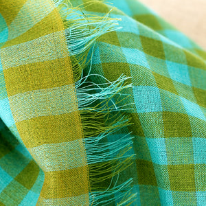 Closeup of Littles Fern gingham merino wool silk neckerchief showing a small detail of a delicate fringe — © 2026 PilgrimWaters.
