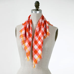 Littles Rory gingham merino wool silk neckerchief draped on a mannequin — © 2026 PilgrimWaters.