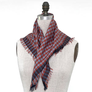 PilgrimWaters Rue neckerchief scarf with fringed edges draped on a dress form mannequin.