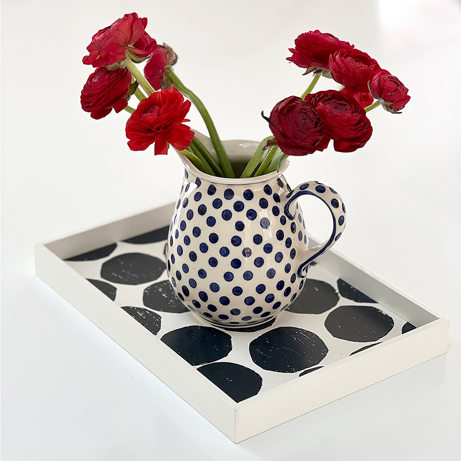 Blueberry mini color valet tray by PilgrimWaters featuring an abstract hand-printed dot design, styled on a table with a dot ceramic jug and fresh flowers.