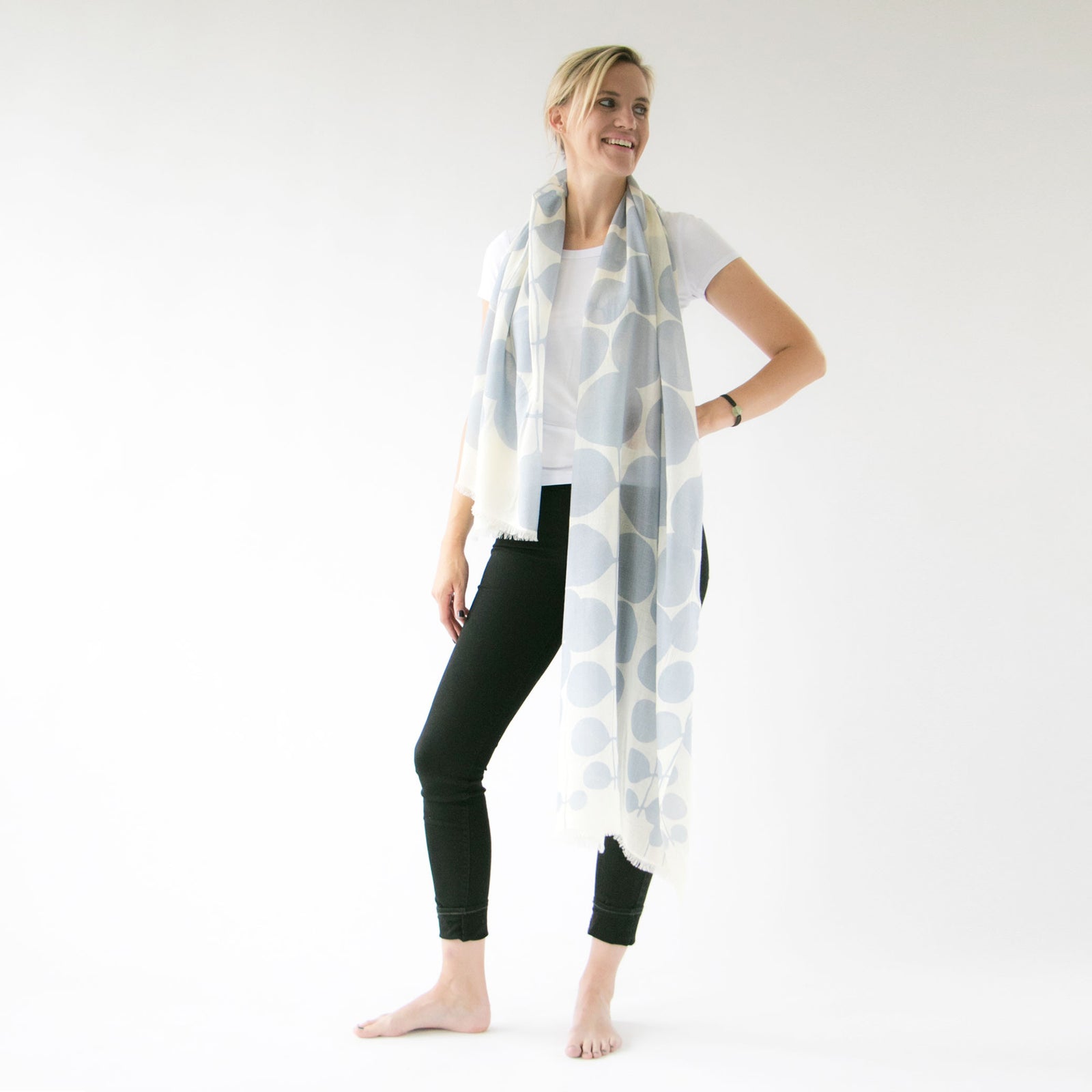 Until Merino Wool scarf styled with a model. Botanical design by Susy Pilgrim Waters.