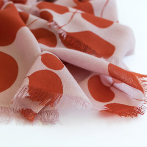 Close up of 100% Merino Wool Poppy design showing the print quality and frayed edges.