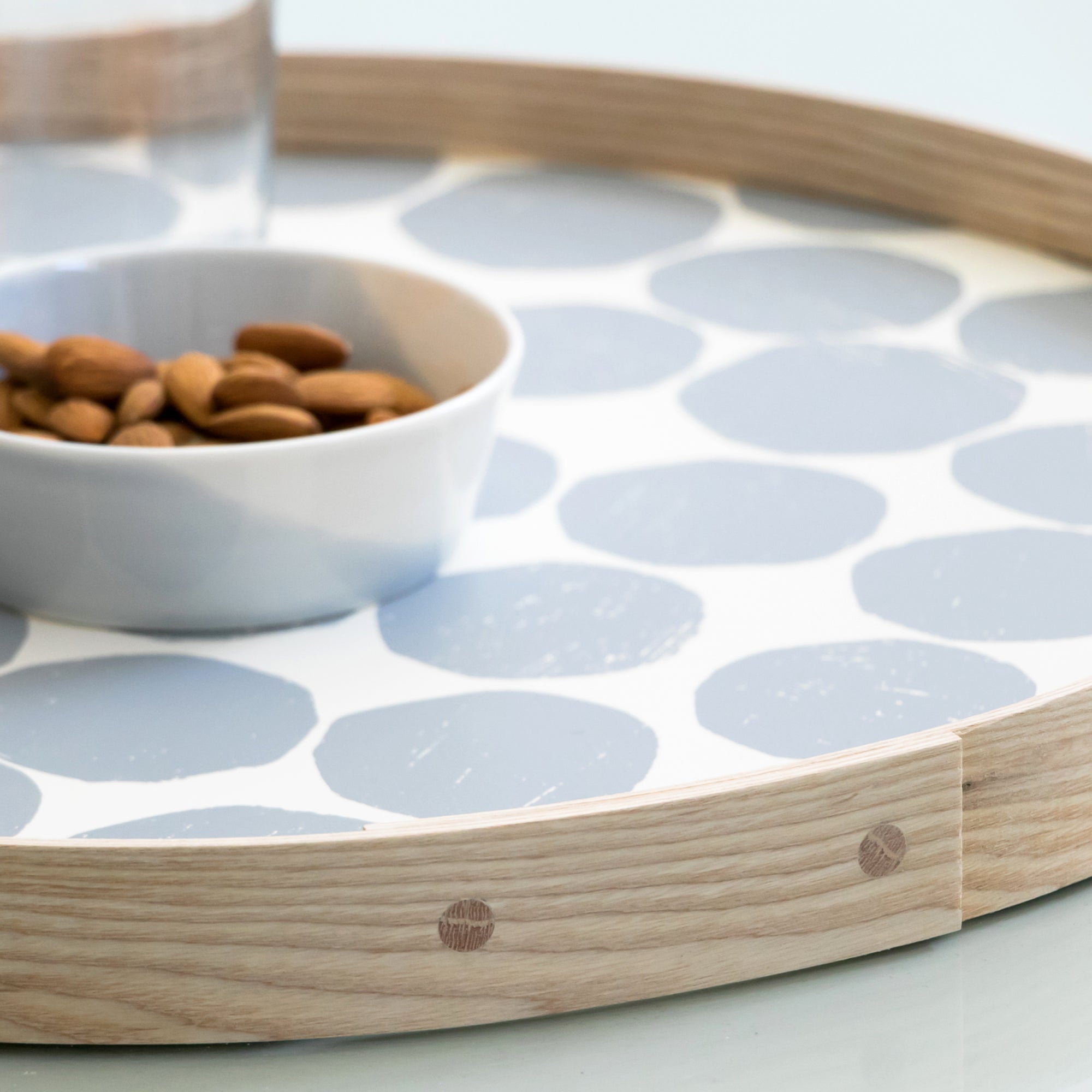Round tray gray on white closeup